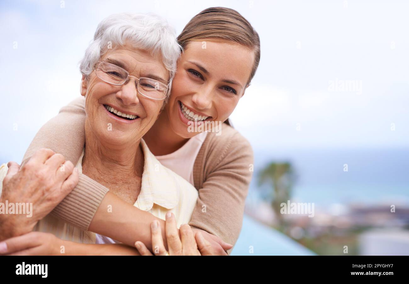 She means the world to me. Portrait of an affectionate mother and daughter standing outdoors. Stock Photo