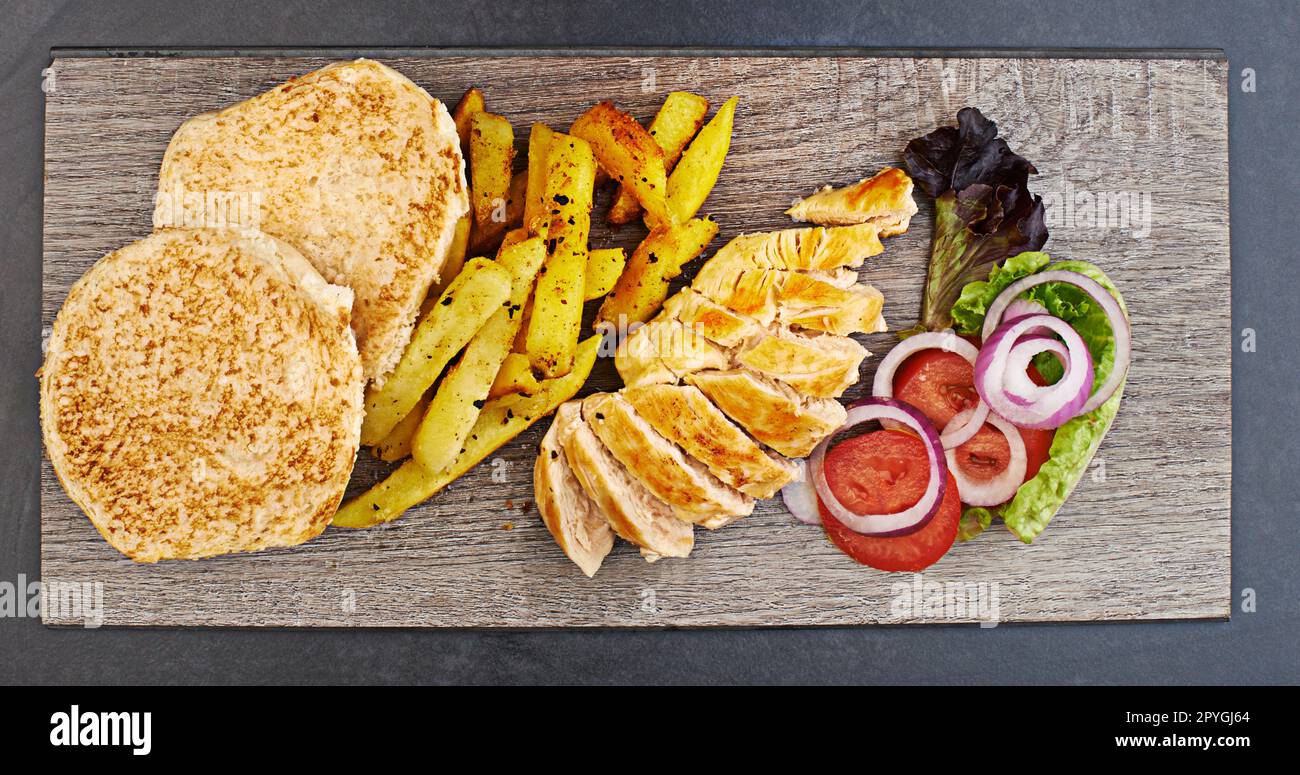 Theres no love sincerer than the love of food. High angle studio shot of an expertly prepared meal on a table. Stock Photo