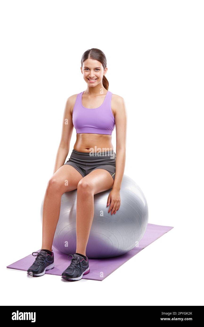 The only bad workout is the one that didnt happen. a beautiful young woman doing exercises on her fitness ball. Stock Photo