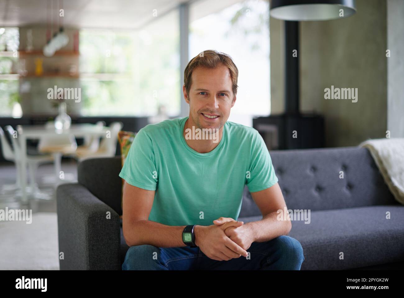 Weekends are a welcome break. a handsome young man at home. Stock Photo