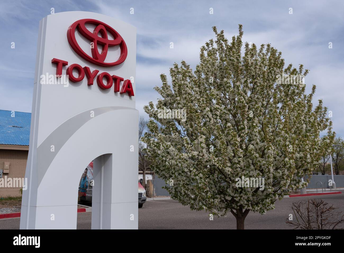 Tall white pylon sign with red three circle logo for Toyota automobile