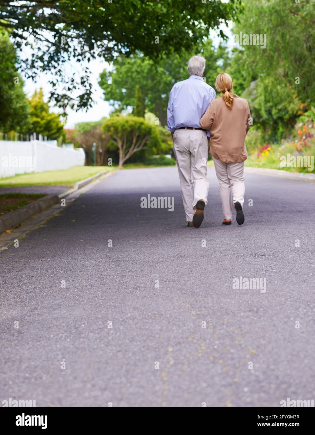Theres no I in us. Low angle shot of a senior couple walking together. Stock Photo
