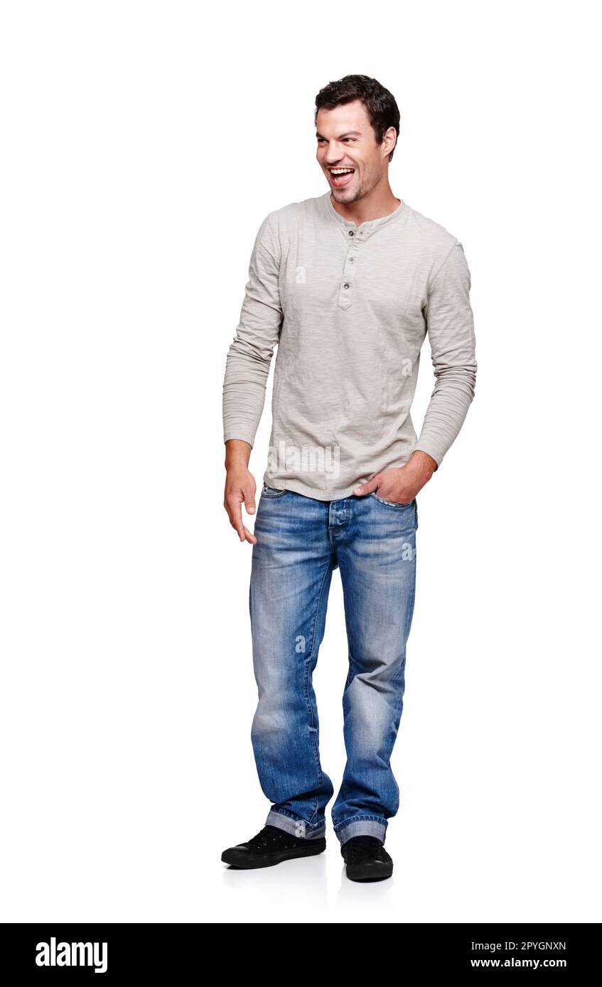 Whats up. Full length of a handsome young man standing with his hands in his pockets - isolated. Stock Photo