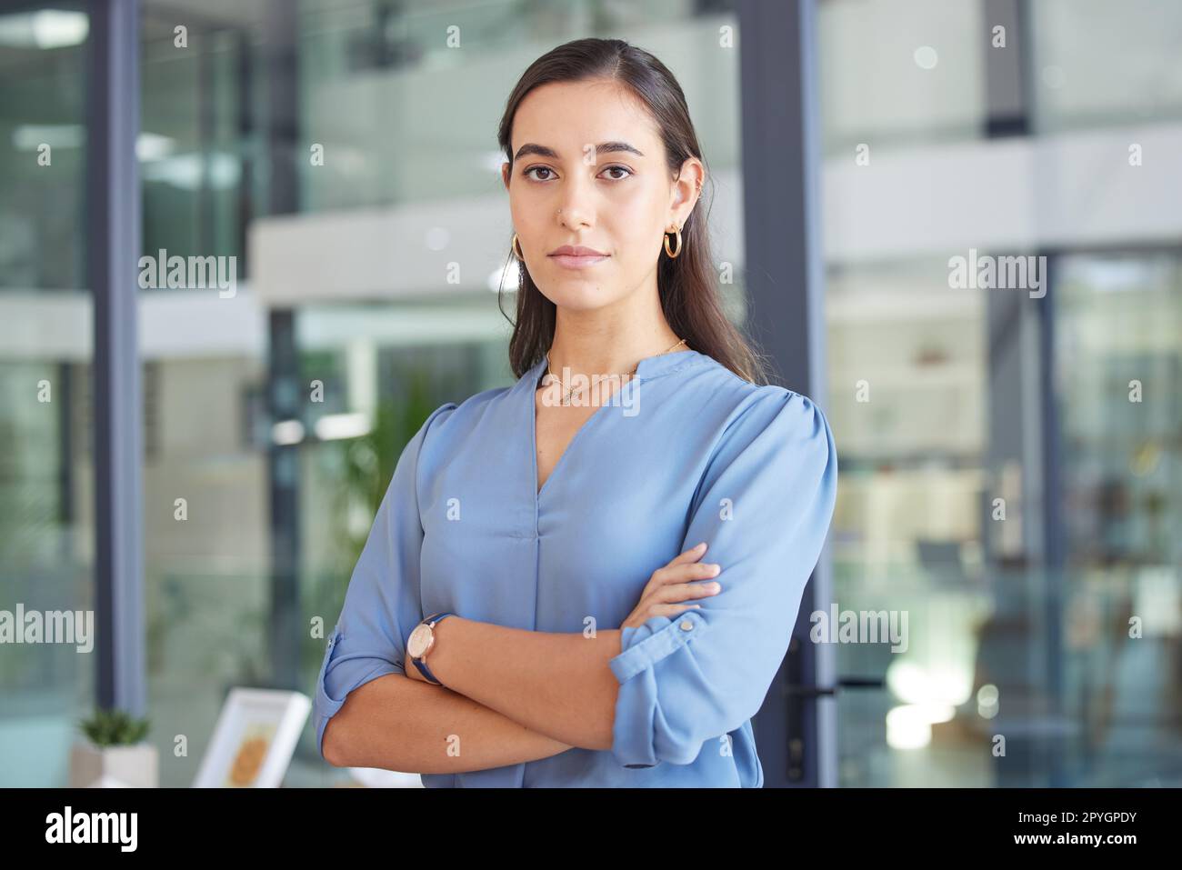 Face, leadership and business woman with arms crossed in office ready for targets or goals. Ceo, boss and portrait of proud female entrepreneur from Canada with vision, mission and success mindset Stock Photo
