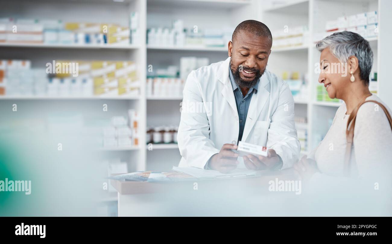 Pharmacy, medicine and senior woman consulting pharmacist on prescription. Healthcare, shopping and elderly female in consultation with medical worker for medication box, pills or product in store. Stock Photo