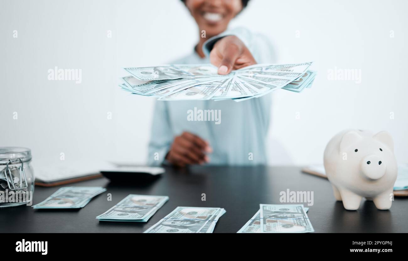 Hand, dollars and black woman with money for payment, financial investment or bribe in office. Currency, finance or business woman offering cash for banking, deal or savings, loan or money laundering Stock Photo
