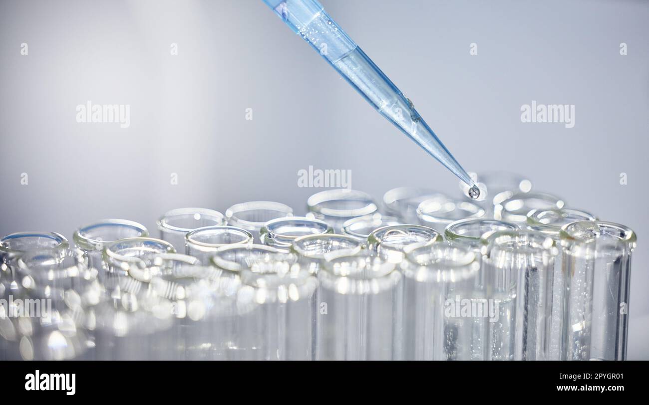 Science, test tubes and syringe for research, experiment or project in chemistry laboratory. Glass vials, innovation and chemical liquid for scientific innovation or analysis in a pharmaceutical lab. Stock Photo