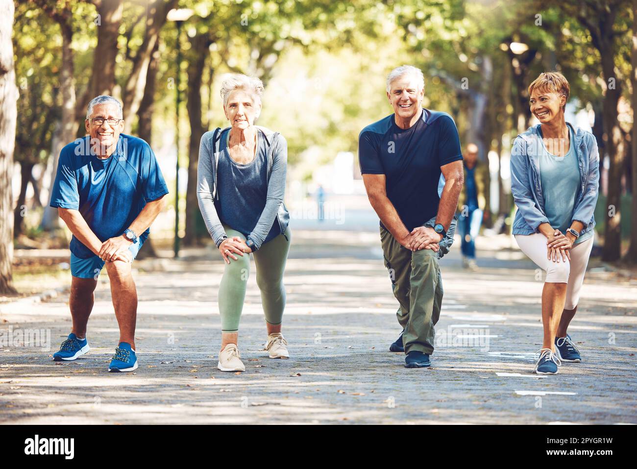 Senior friends, stretching exercise and park with smile, wellness and ...
