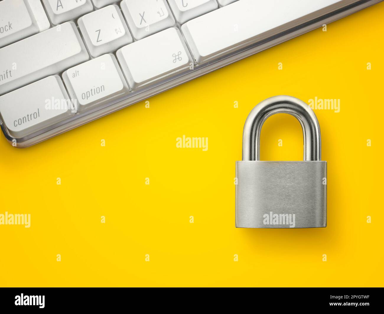 Computer security concept. Unlocked padlock on laptop keyboard. Stock Photo