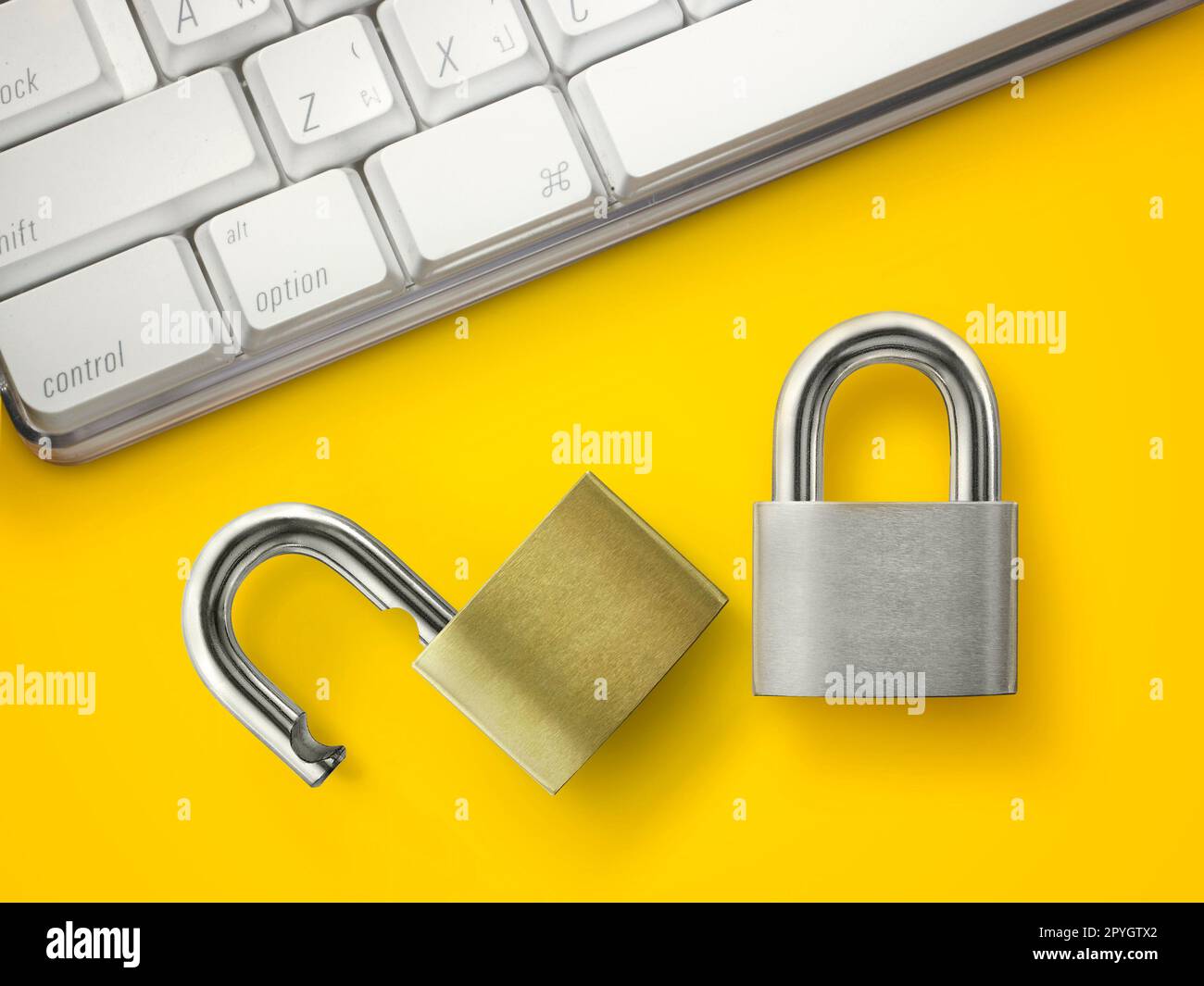 Computer security concept. Unlocked padlock on laptop keyboard. Stock Photo