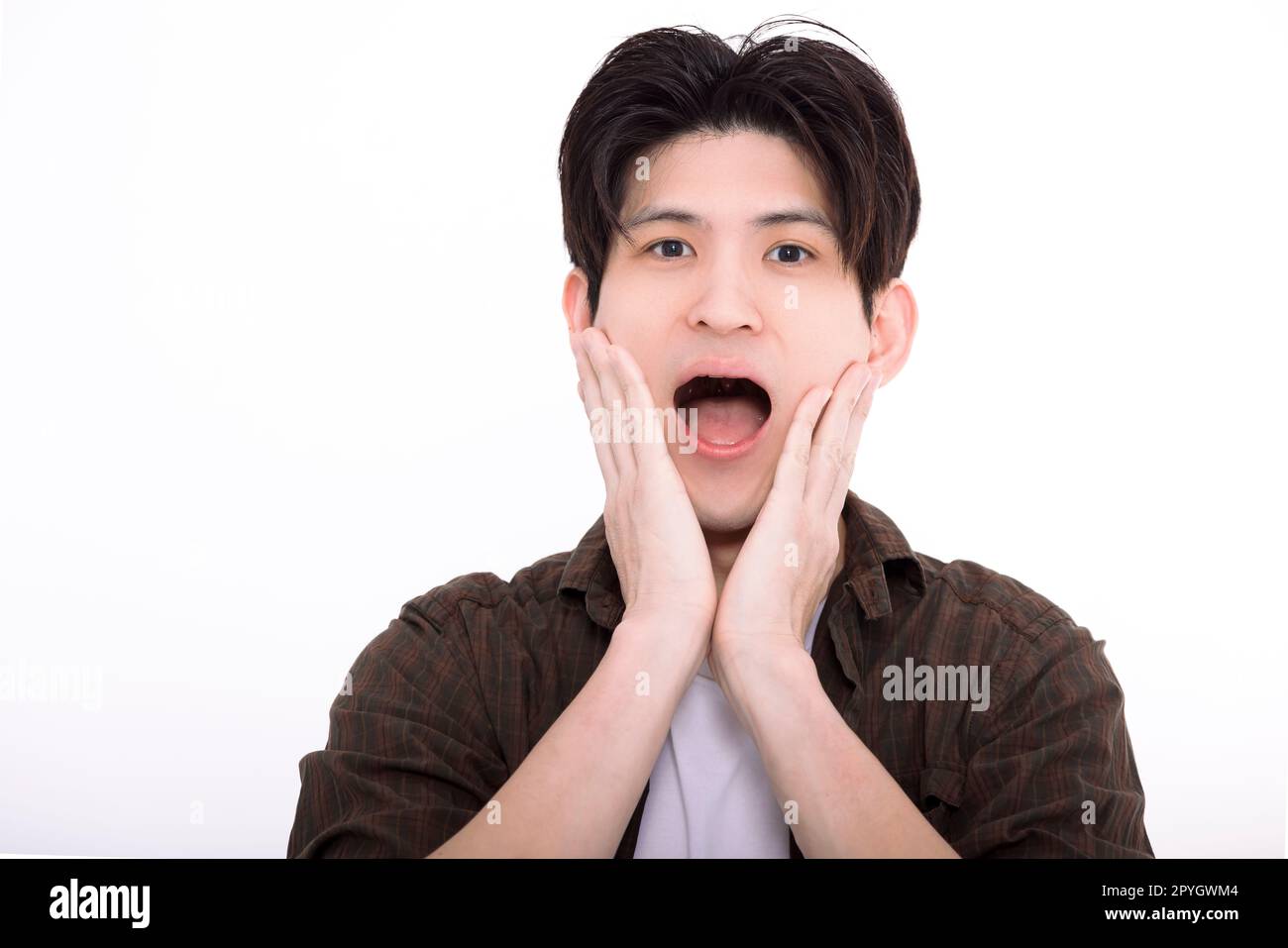 surprised young man looking at camera Stock Photo