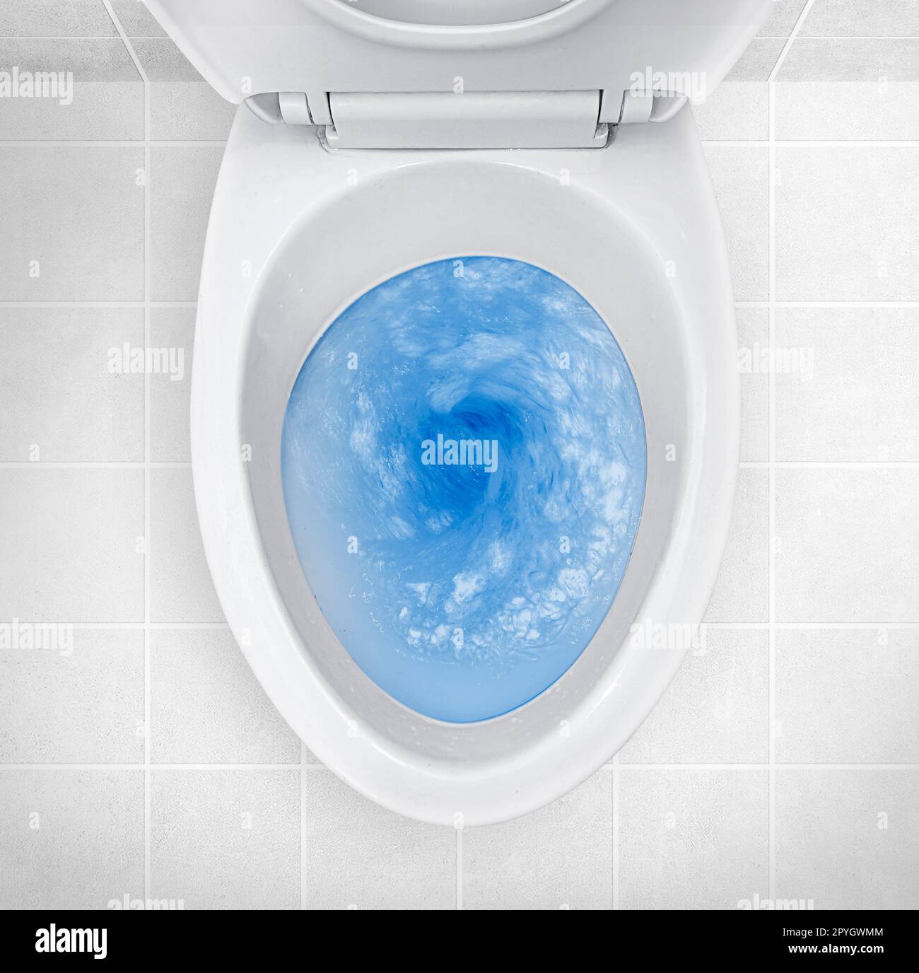 Top view of toilet bowl, blue detergent flushing in it Stock Photo Alamy