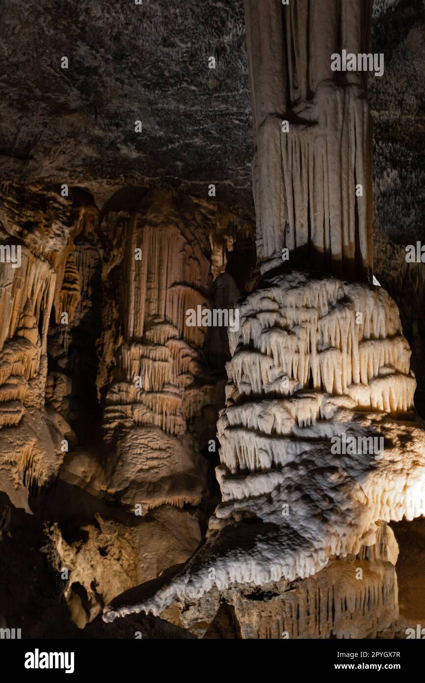 Dripstone column in the famous karst cave Stock Photo