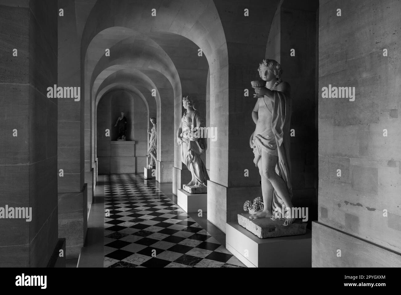 Marble statues in the historical hallway Ground Gallery of Versailles