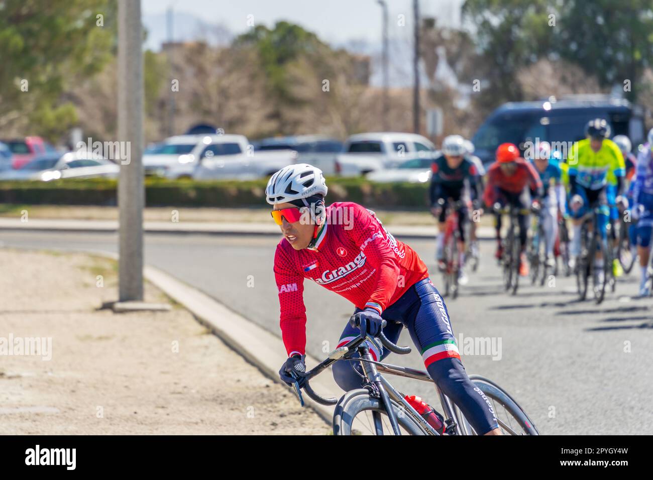 Victorville, CA, USA – March 26, 2023: Individual cyclist taking the lead in the men’s cycling road race event held by Majestic Cycling in Victorville Stock Photo