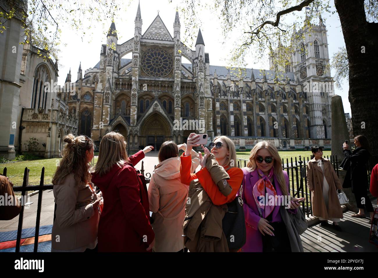 London England 03 05 2023 People Walk Past The Westminster Abbey london-england-03-05-2023-people-walk-past-the-westminster-abbey
