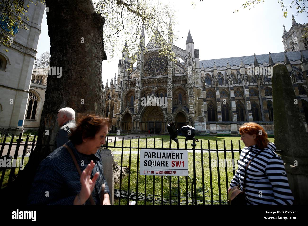 London England 03 05 2023 People Walk Past The Westminster Abbey london-england-03-05-2023-people-walk-past-the-westminster-abbey