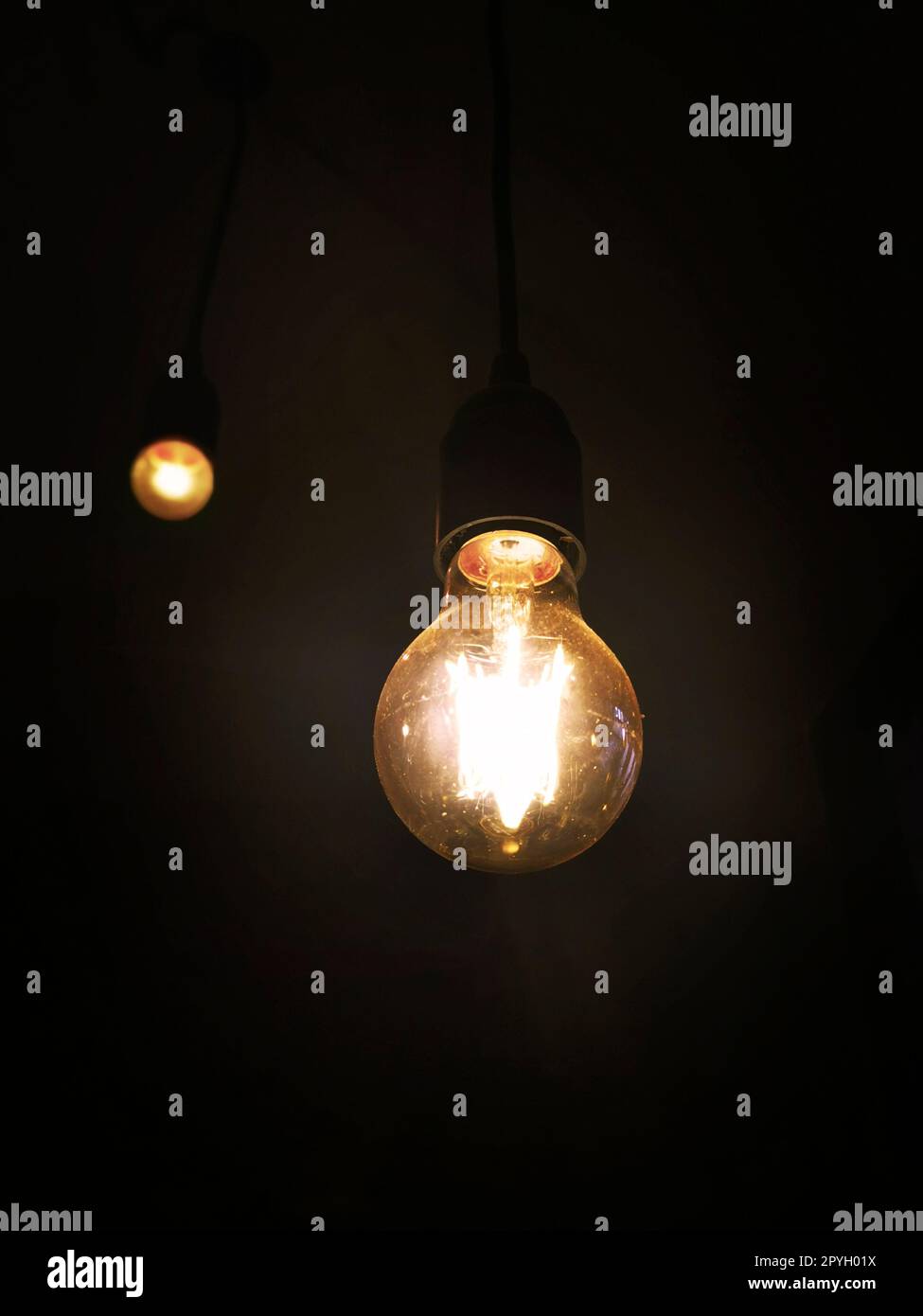 Light bulb on black background Stock Photo Alamy