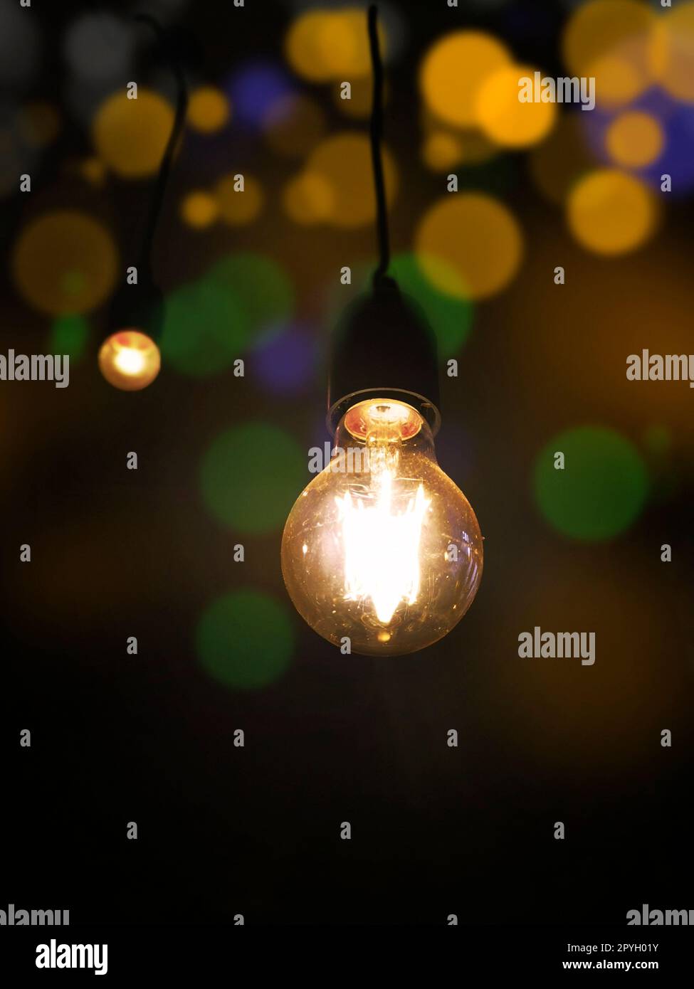 Light bulb on black background abstract bokeh lights with soft light Stock Photo