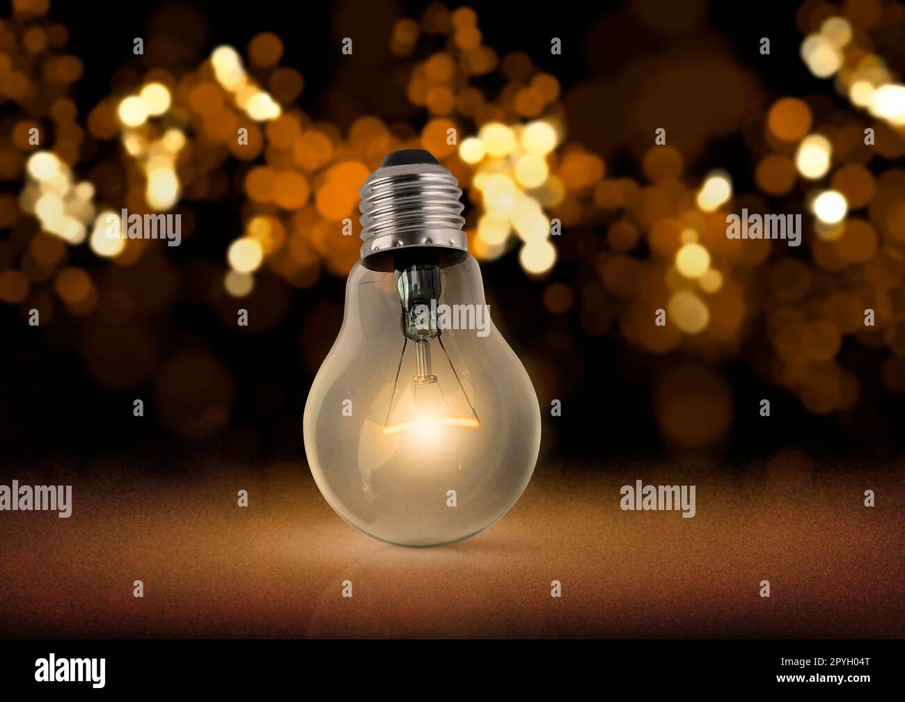 Lighting decor. Retro light bulb filament close up.Illuminated Stock Photo