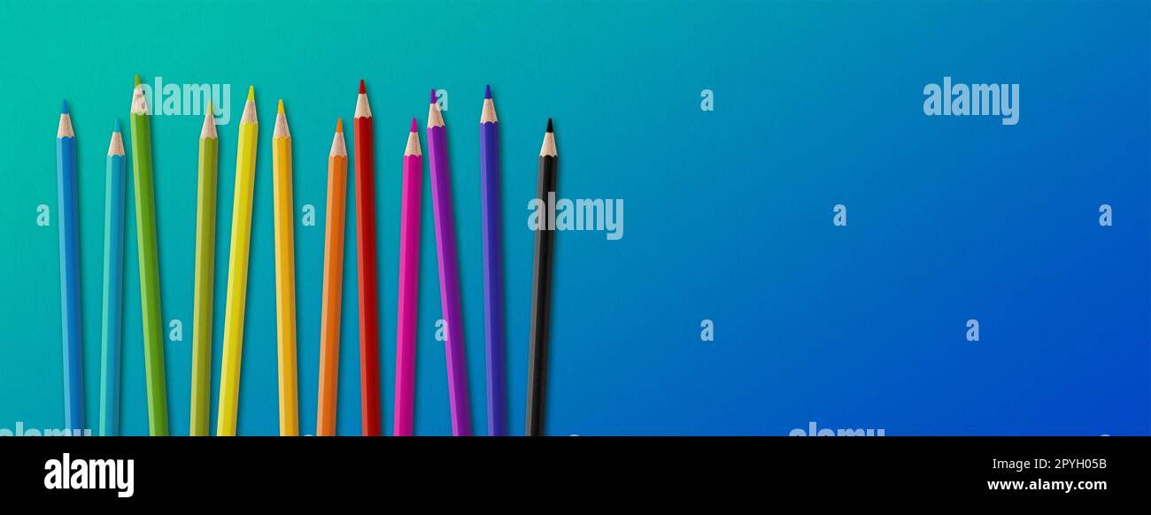 Colored pencil group isolated on blue. Panoramic banner background Stock Photo