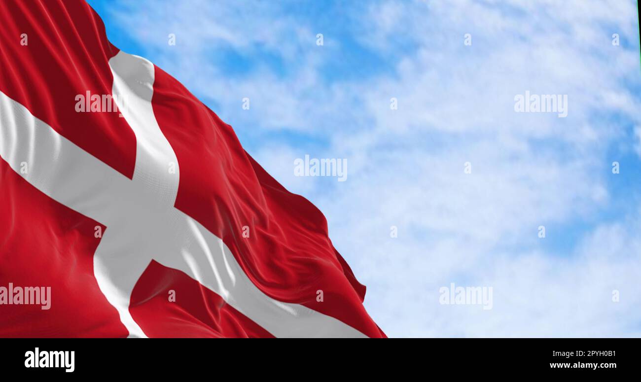 Denmark national flag waving in the wind on a clear day. Stock Photo