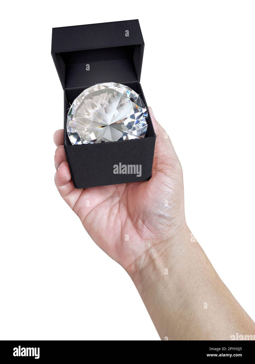 Dazzling diamond in a gift box on hand Stock Photo