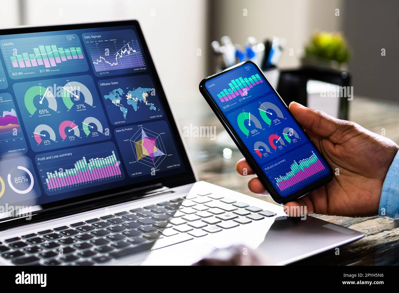 African Advisor Using KPI Dashboard Stock Photo