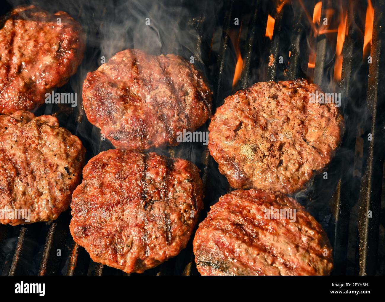 Beef burger for hamburger on barbecue grill Stock Photo