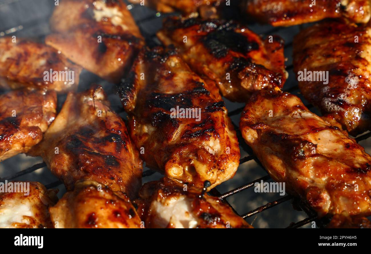 Chicken buffalo wings cooked on BBQ grill Stock Photo