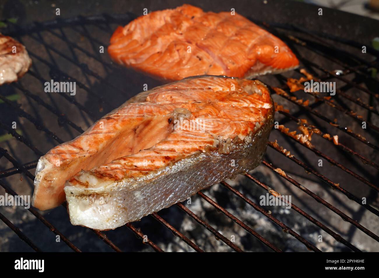 Cooking salmon fish steak on BBQ grill Stock Photo Alamy