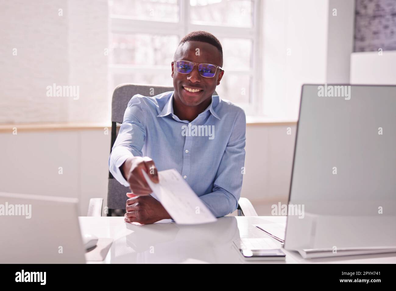 Payroll Cheque. Giving Paycheck Compensation Stock Photo