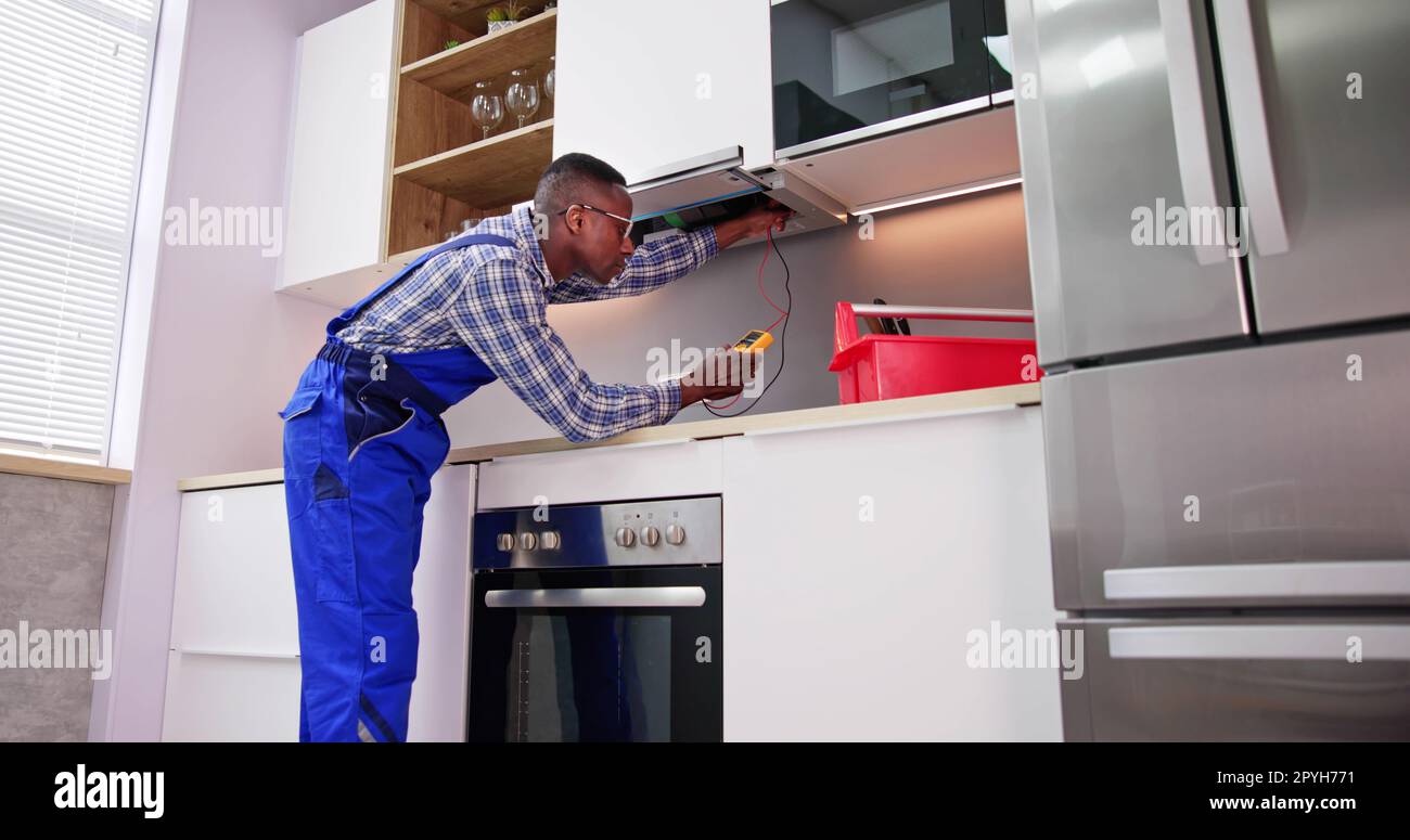 Young black technician repairing hi res stock photography and images