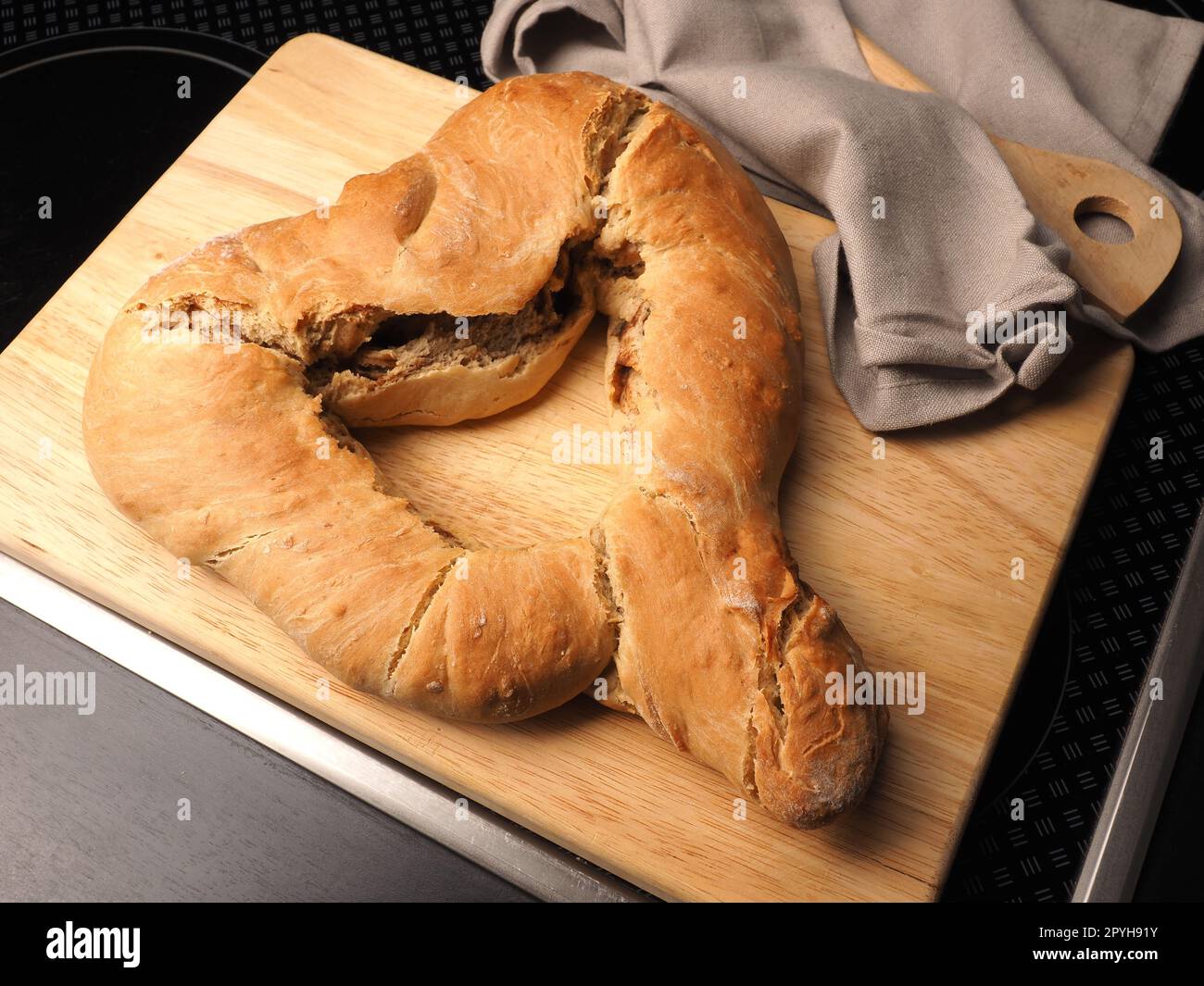 Yeast dough formed into a heart, baked until golden brown Stock Photo