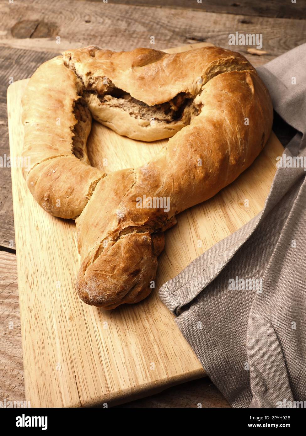 Yeast dough formed into a heart, baked until golden brown Stock Photo