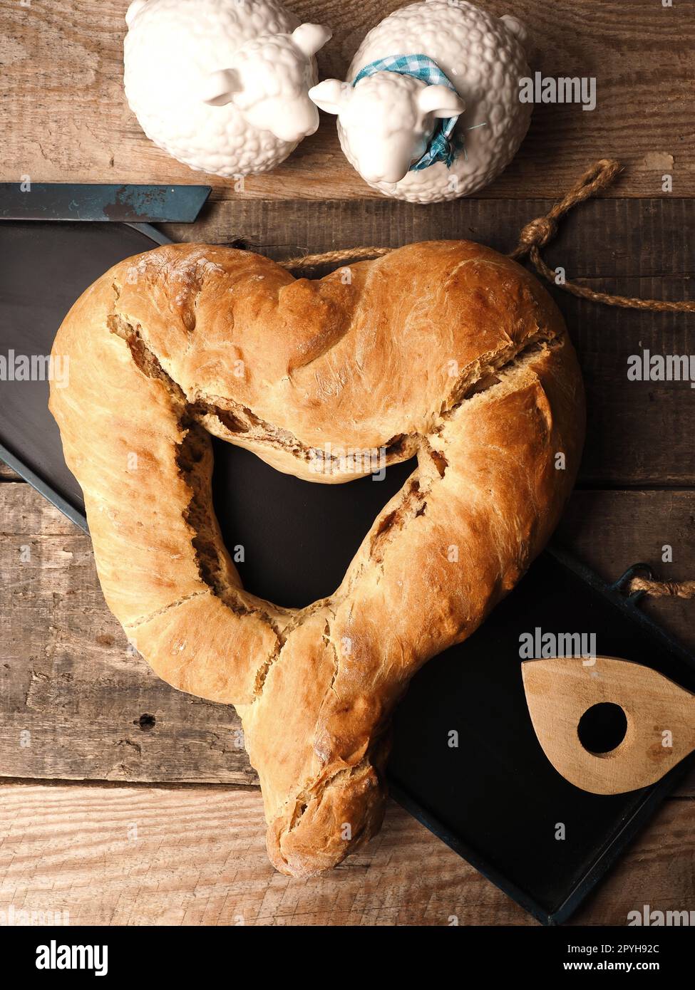 Yeast dough formed into a heart, baked until golden brown Stock Photo
