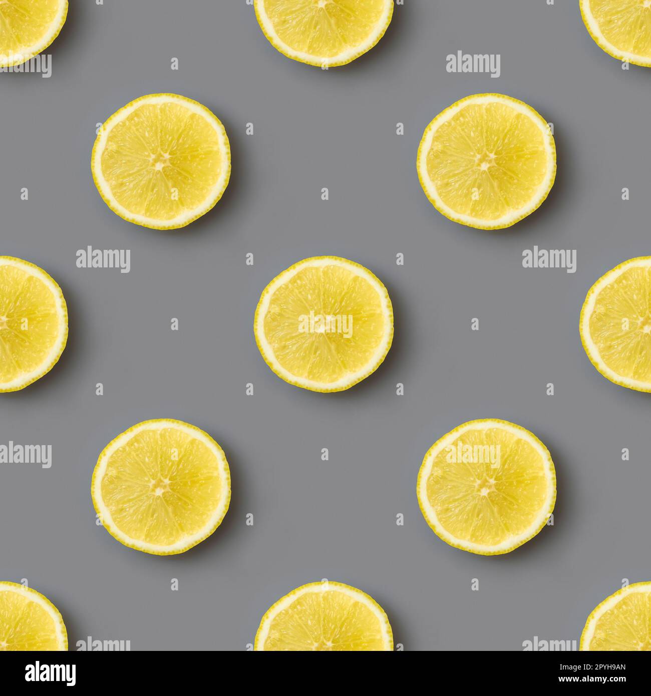 Yellow lemons on gray background seamless endless pattern. Colors of the Year 2021 Illuminating and Ultimate gray Stock Photo