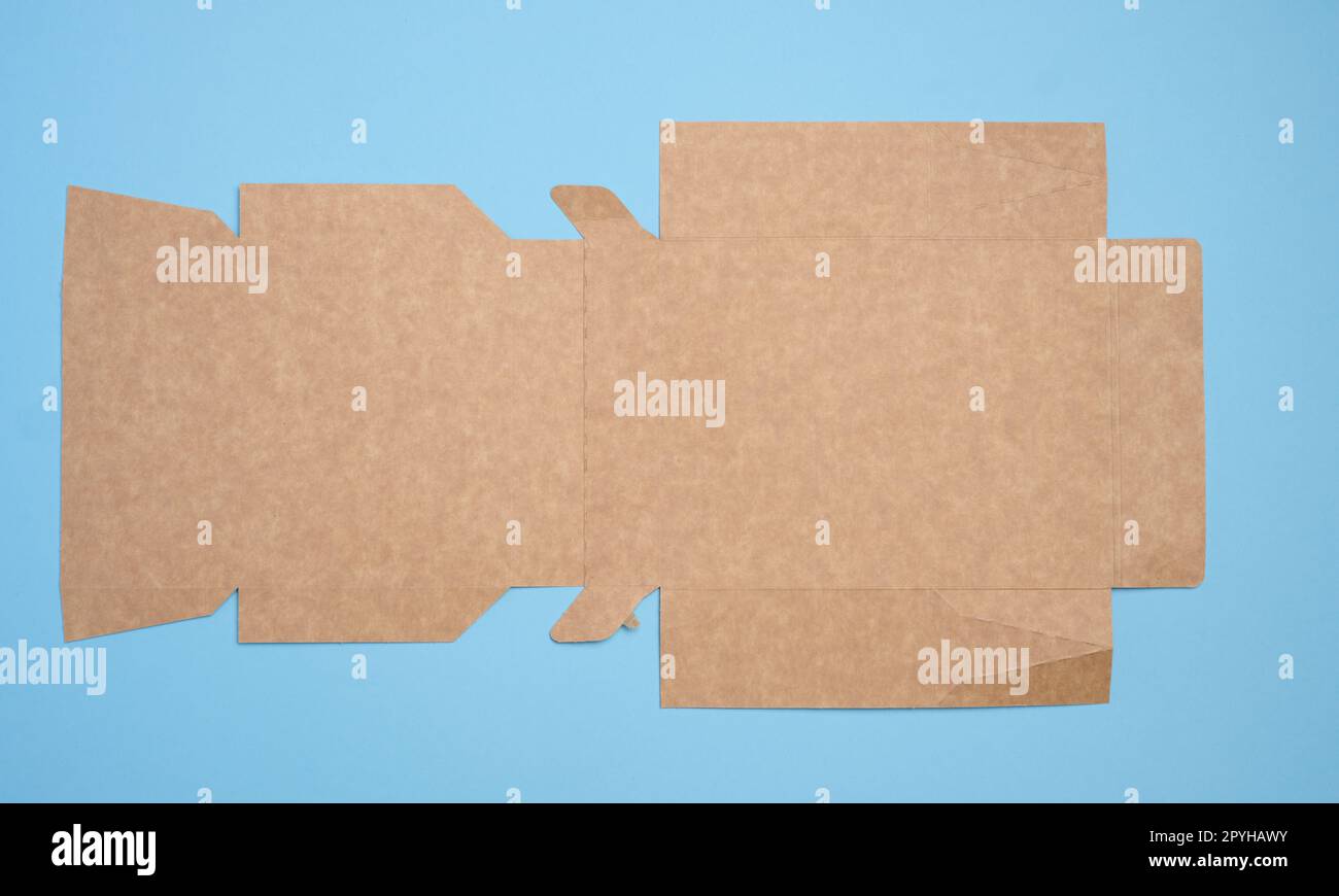 A brown cardboard box in an unfolded state on a blue background, food