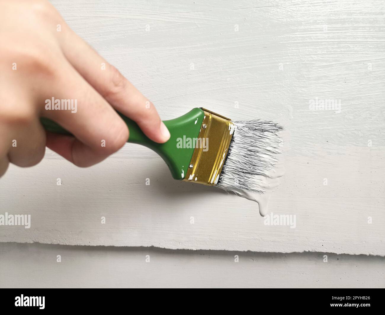 Artist hand holding brush hi-res stock photography and images - Alamy