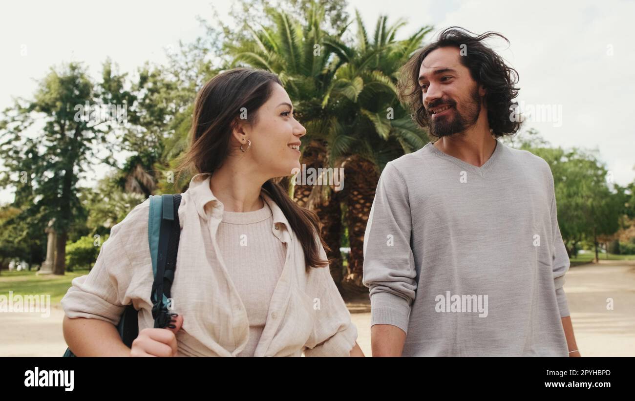 Couple in love walking in the park holding hands Stock Photo - Alamy