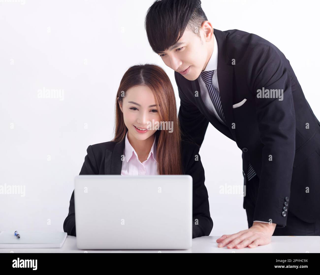 Business team using laptop and working together in office Stock Photo ...
