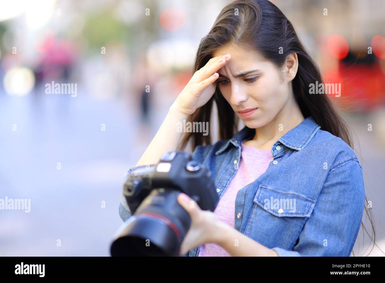 Worried photographer checking photoshoot results Stock Photo