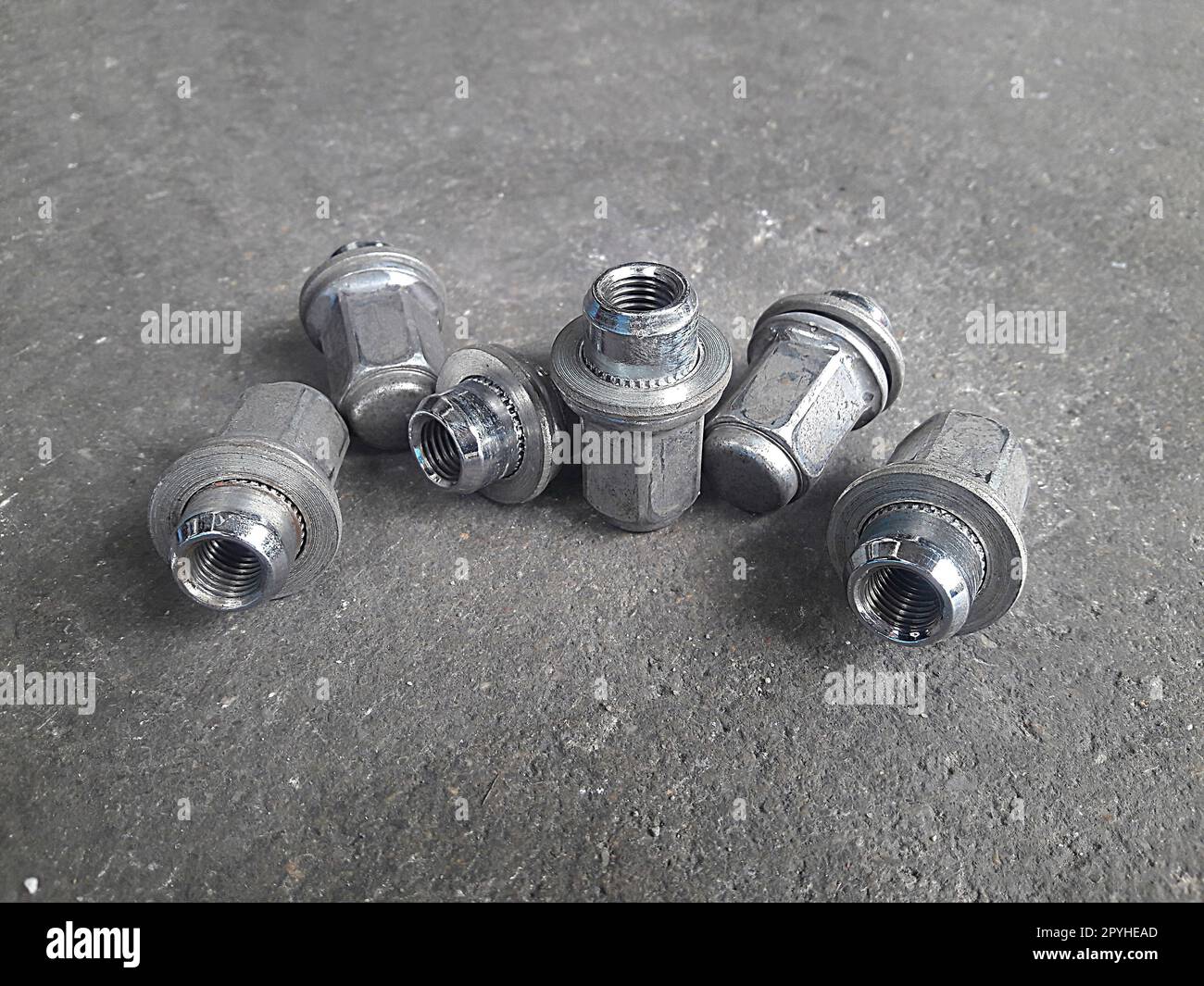 Car service, nut of fixture of a wheel of the car Stock Photo Alamy