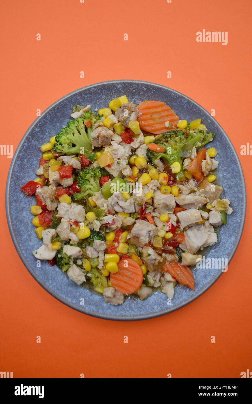 Honey soy chicken with vegetables on a plate Stock Photo