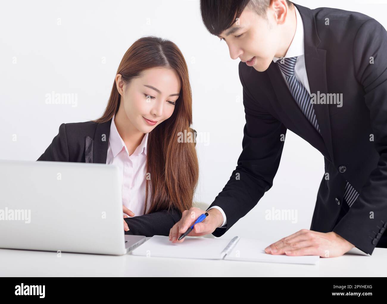 Business team using laptop and working together in office Stock Photo ...
