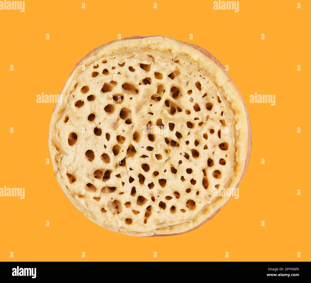 Crumpet isolated on the yellow Stock Photo
