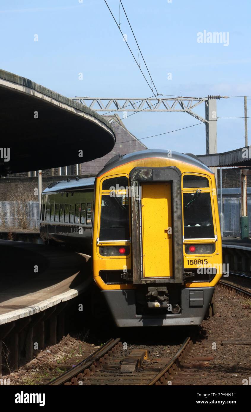 Northern trains class 158 express sprinter diesel multiple-unit 158815 in platform 2 at Carnforth railway station on Wednesday 3rd May 2023. Stock Photo