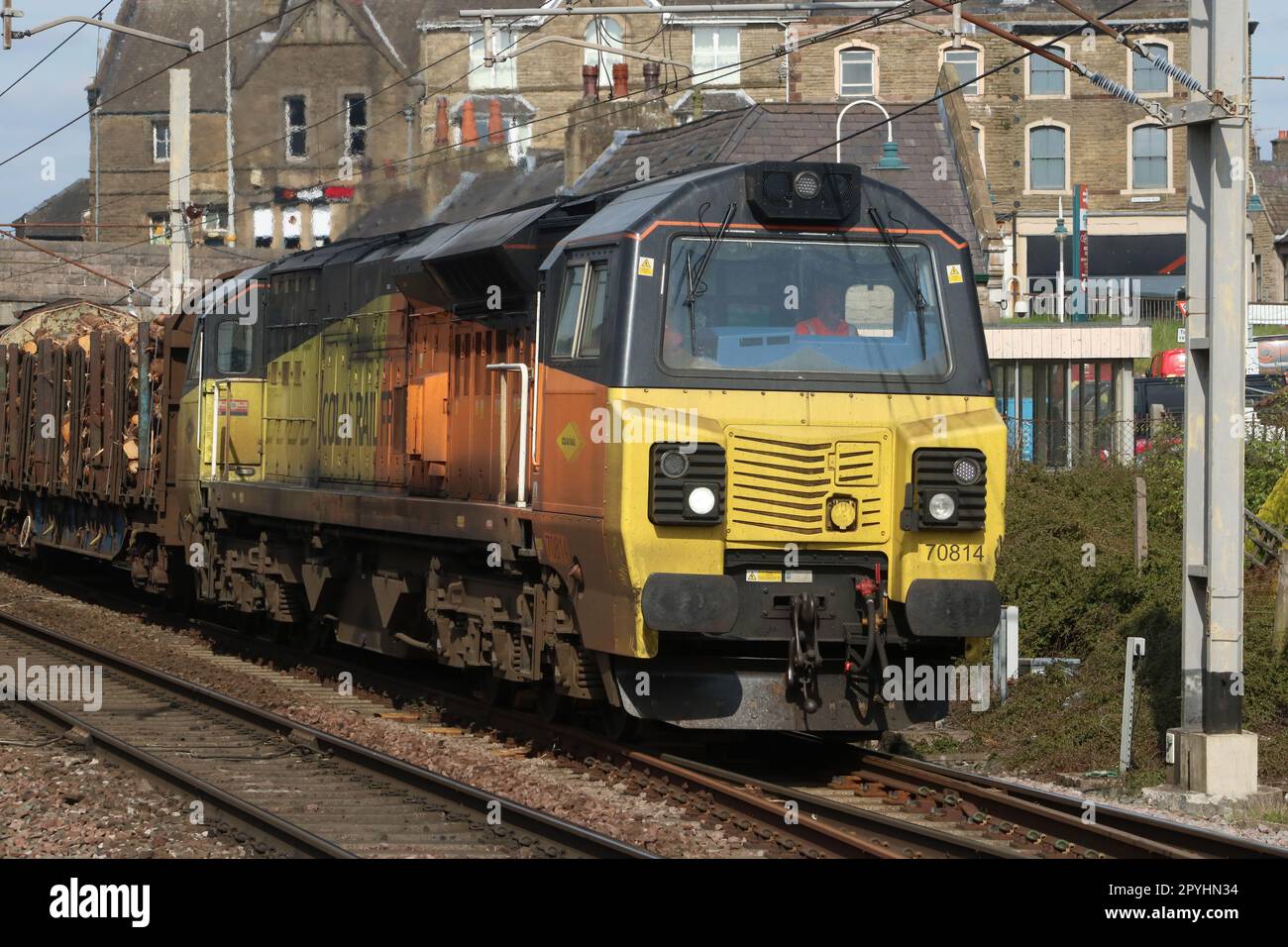 General Electric Powerhaul class 70 diesel-electric loco 70814 in Colas Rail Freight orange and yellow livery on WCML at Carnforth, 3rd May 2023. Stock Photo