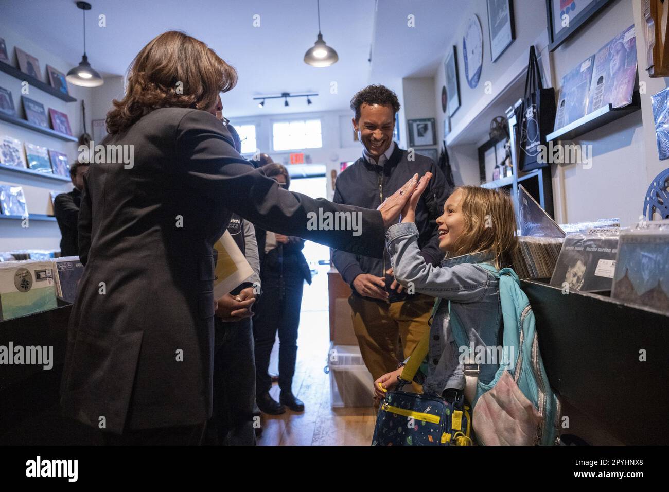 Washington, United States. 03rd May, 2023. U.S. Vice President Kamala Harris high-fives with Esmé Pleasant as her father Zach looks on at Home Rule Record store in Washington, DC on Wednesday, May 3, 2023. Photo by Ken Cedeno/UPI Credit: UPI/Alamy Live News Stock Photo