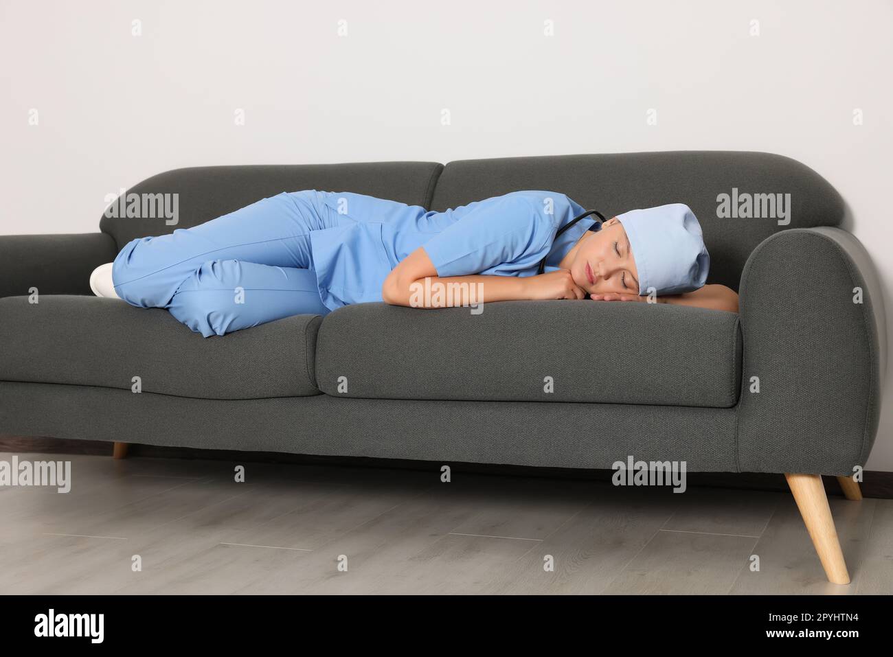 Tired young doctor hi-res stock photography and images - Alamy